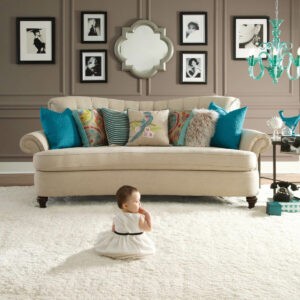 Cute baby sitting on carpet floor | Rugs Rolls and More